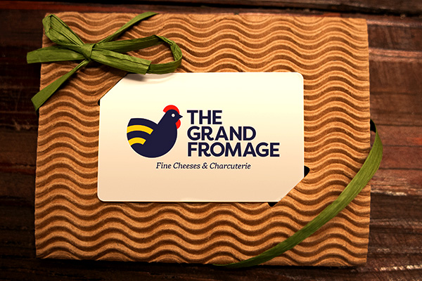 The Grand Fromage gift card in decorative holder